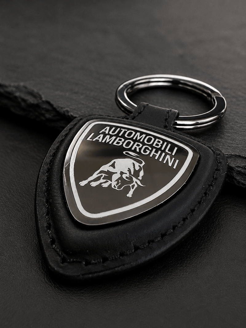 Portachiavi Automobili Lamborghini in pelle con logo e anello per chiavi, elegante e di alta qualità.